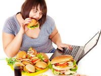955572_581063woman-eating-junk-foodjpg-1jpg
